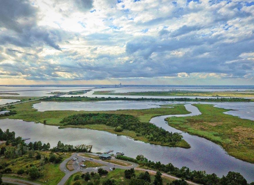 MEANDERING STREAMS WITH CLOUDY BLUE SKY